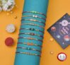 TECHBASICS Combo of 10 Dora Rakhi Set for Brother, Bhaiya, Bhabhi for Rakhi/Rakshabandhan with Roli Chawal & Greeting Card | Premium Rakhi Hamper RKHMPR52